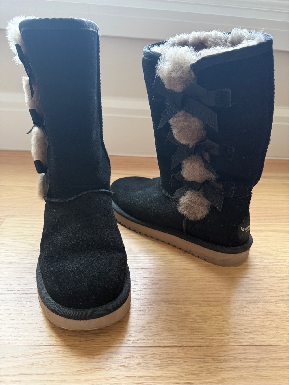 Koolaburra Black Suede Short Boots with Cream Faux Fur Pom Accent